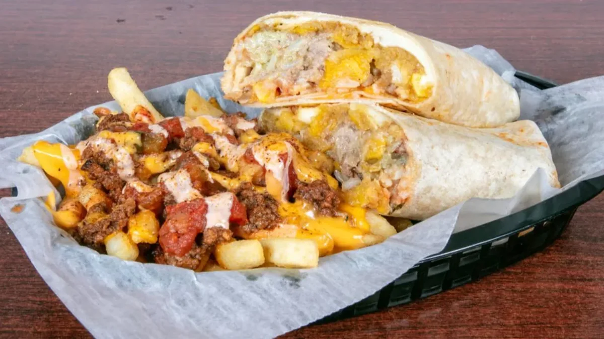 Mofongo burrito and loaded fries in a basket at TKO Round 2